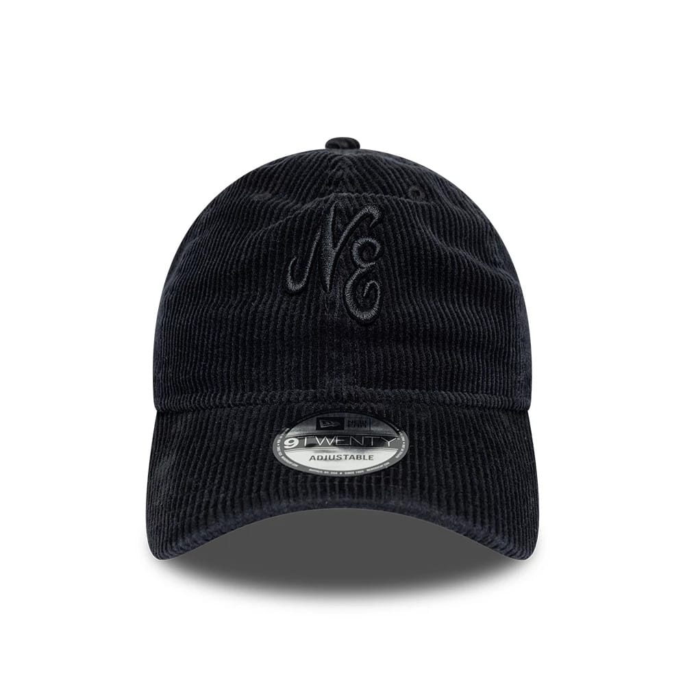 New Era Washed Cord Black 9TWENTY Adjustable Cap, front view showing the raised embroidery of the NE logo on the structured black corduroy crown, with a 9TWENTY size sticker on the curved visor.