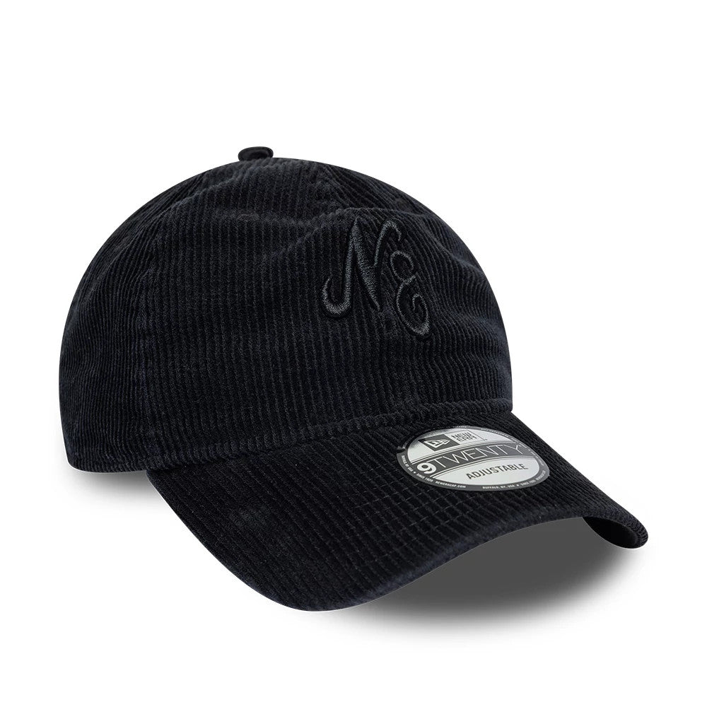 New Era Washed Cord Black 9TWENTY Adjustable Cap, front view showing the embroidered initials on the front panel, a curved black cord visor, and the 9TWENTY size sticker placed on the top of the visor.