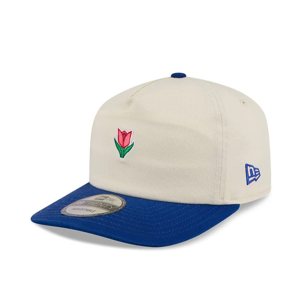 New Era Tulip Cream 19TWENTY Adjustable Cap, three-quarter view showing a red and green embroidered tulip on the front panel, a blue flat visor with a 19TWENTY size sticker, and a blue New Era flag logo on the left side.