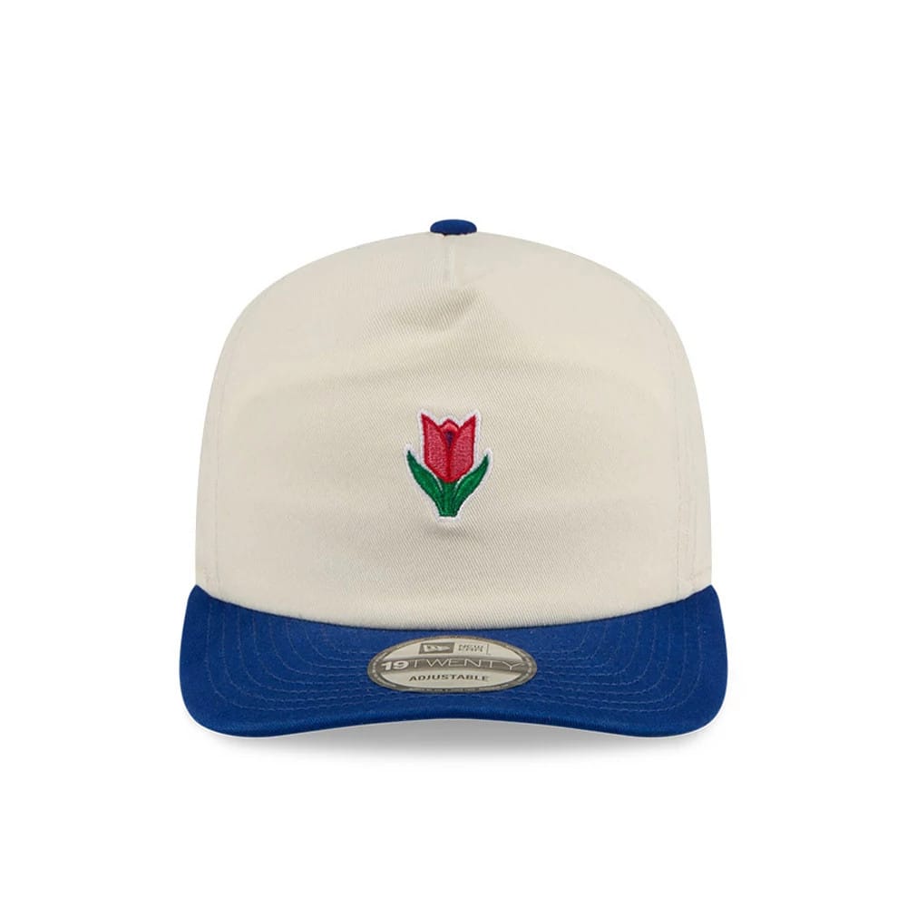New Era Tulip Cream 19TWENTY Adjustable Cap, front view showing a red and green embroidered tulip on the cream crown, with a contrasting blue curved visor and a 19TWENTY size sticker centrally placed on the visor.