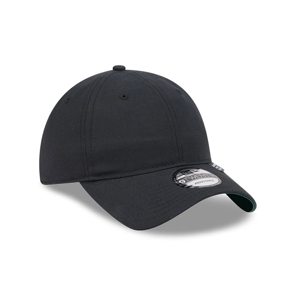 New Era Recycled Twill Black New Era 9TWENTY Adjustable Cap, front view showing the curved black visor with a 9TWENTY size sticker, a structured black crown with stitching, and a top button, with green under the visor edge.
