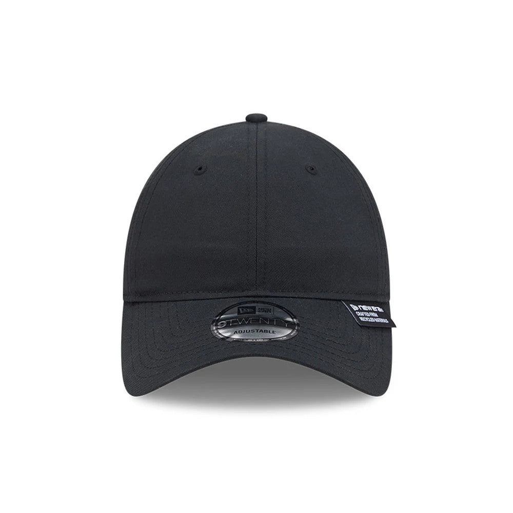 New Era Recycled Twill Black New Era 9TWENTY Adjustable Cap, front view showing a curved black visor with a 9TWENTY size sticker on top, eyelets for ventilation on the crown, and a small branded tag on the edge of the visor.