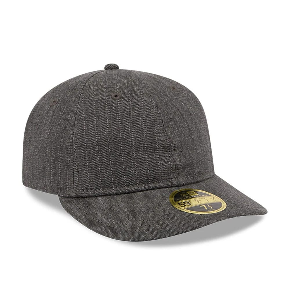 New Era Herringbone Charcoal Retro Crown 59FIFTY Fitted Cap, three-quarter view showing a herringbone pattern on a rounded crown, a curved visor with a gold 59FIFTY size sticker on top, and matching charcoal button and eyelets.