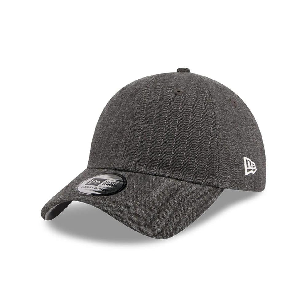 New Era Herringbone Pinstripe Charcoal Casual Classic Adjustable Cap, three-quarter view showing a black pre-curved visor with a size sticker, prominent herringbone pinstripe pattern on the structured crown.