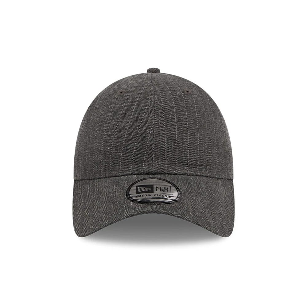 New Era Herringbone Pinstripe Charcoal Casual Classic Adjustable Cap, front view showing a curved visor with a New Era Casual Classic sticker, detailed herringbone pinstripe pattern on the structured crown, and embroidered eyelets.