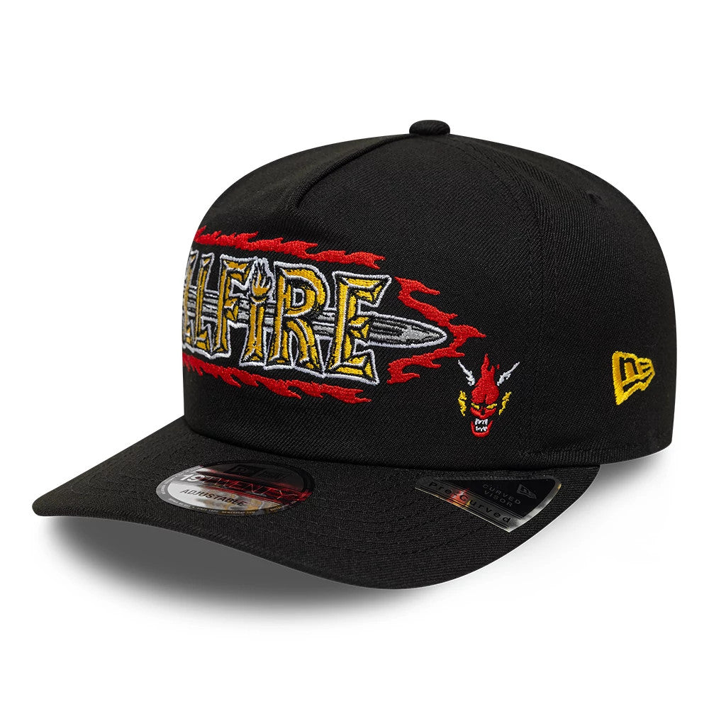 Netflix Stranger Things Hellfire Black New Era 19TWENTY Adjustable Hat, three-quarter view showing the red and yellow Hellfire logo with sword and flames embroidery on the front panel, flat black visor, and yellow New Era flag logo on the left side.