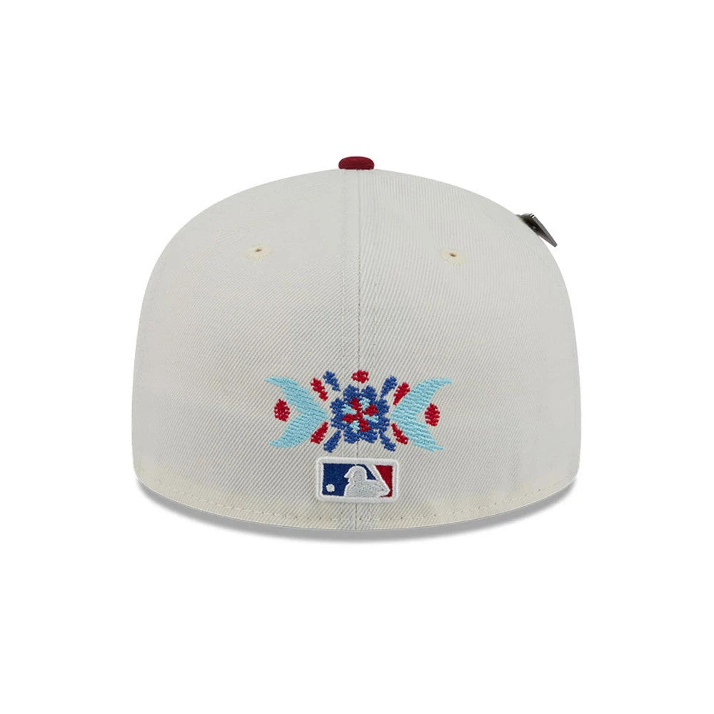 Braves MLB Day Of The Dead Light Beige & Dark Red New Era 59FIFTY Fitted Cap, rear view showing an intricately embroidered floral skull design in red and blue above the MLB Batterman logo.