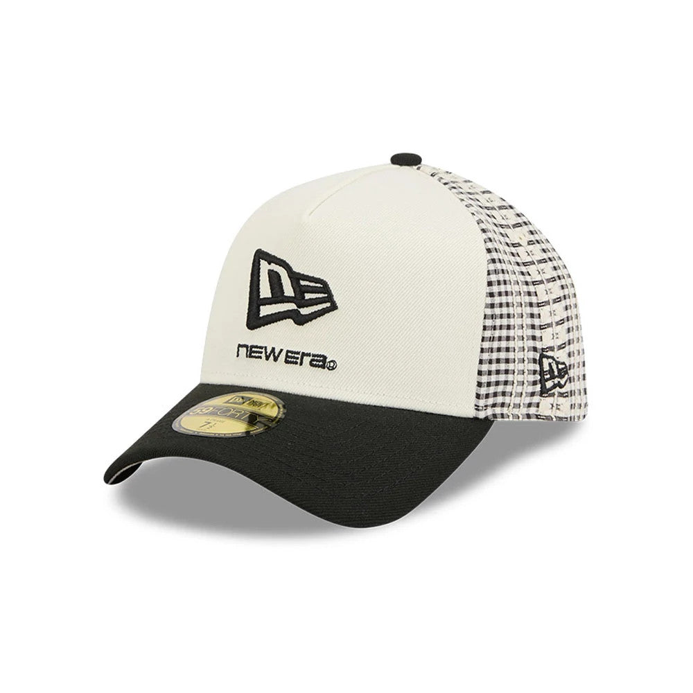 New Era Flag Cream New Era 59FORTY A-Frame Fitted Cap, three-quarter view showing the black New Era flag logo in raised embroidery on the front panel, a gold 59FORTY size sticker on the black visor, and a checked mesh side panel.