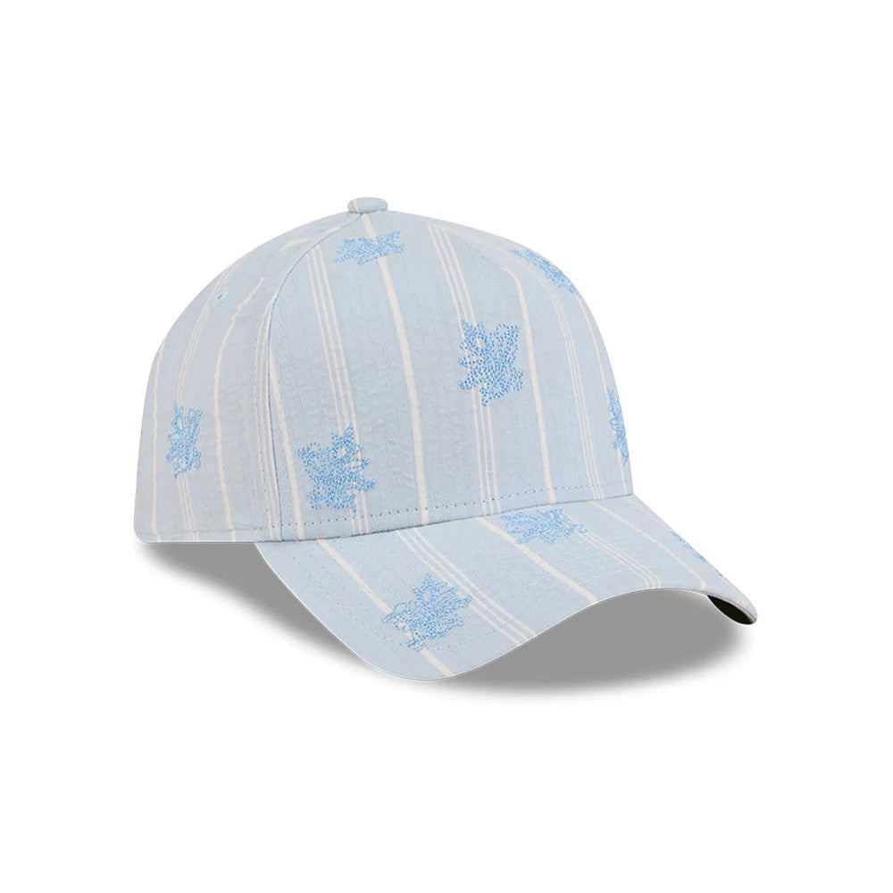New Era Seersucker Pastel Blue 59FORTY A-Frame Fitted Cap, three-quarter view showing a light blue and white striped pattern with embroidered floral motifs, a pre-curved visor, and the top button matching the seersucker fabric.