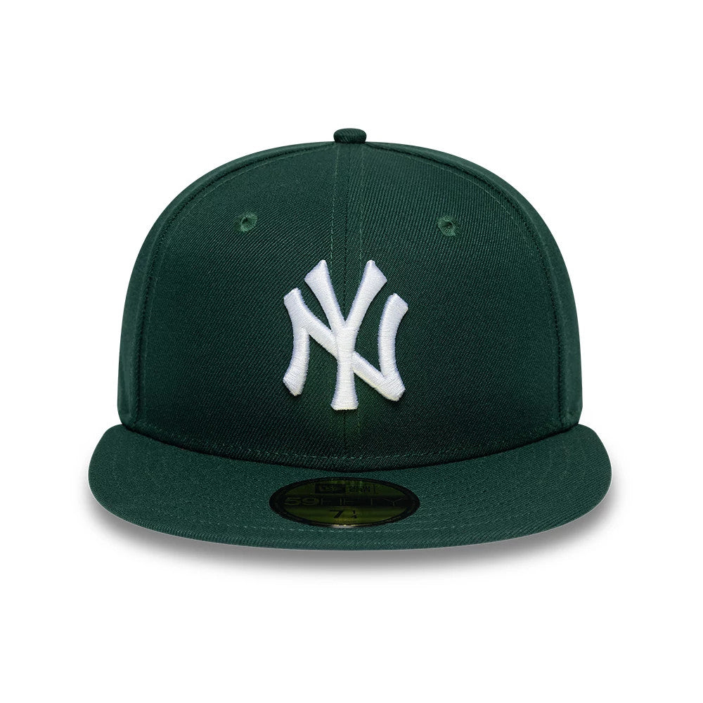 New York Yankees MLB League Essential Dark Green New Era 59FIFTY Fitted Cap, front view showing the white raised embroidered NY logo on the structured dark green crown, with a matching green visor and a gold 59FIFTY size sticker on top.
