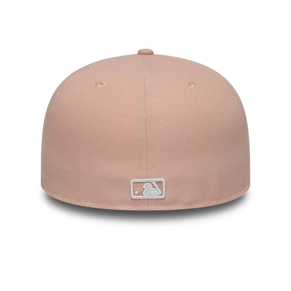 New York Yankees MLB League Essential Pastel Pink New Era 59FIFTY Fitted Cap, rear view showing the embroidered white MLB Batterman logo at the centre back, set against a pastel pink structured crown with a matching top button and eyelets.