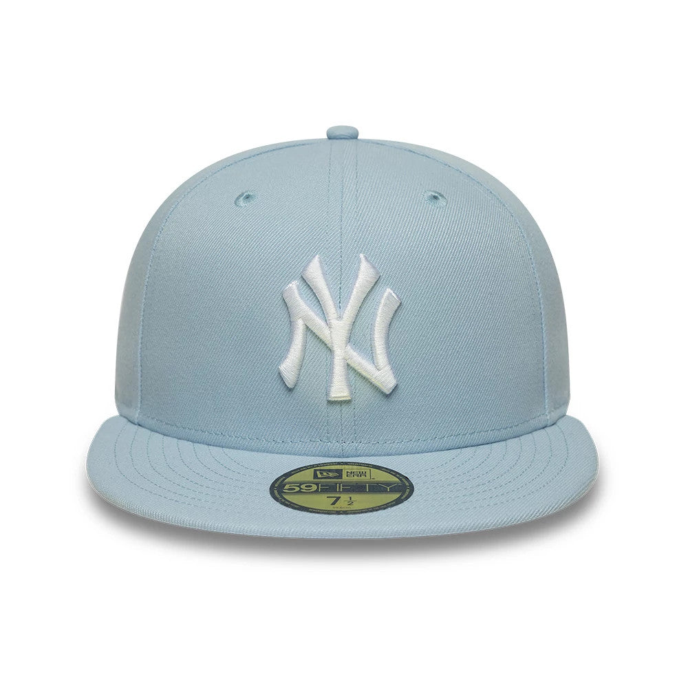 New York Yankees MLB League Essential Pastel Blue New Era 59FIFTY Fitted Cap, front view showing a white raised embroidered Yankees logo on the front panel, a flat pastel blue visor, and a gold 59FIFTY size sticker on the visor.