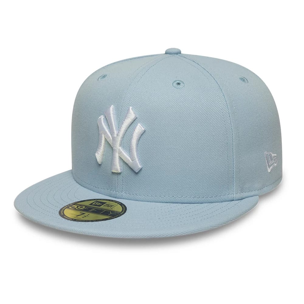 Pictured is this MLB League Essential New York Yankees 59FIFTY Fitted cap in pastel blue. 1