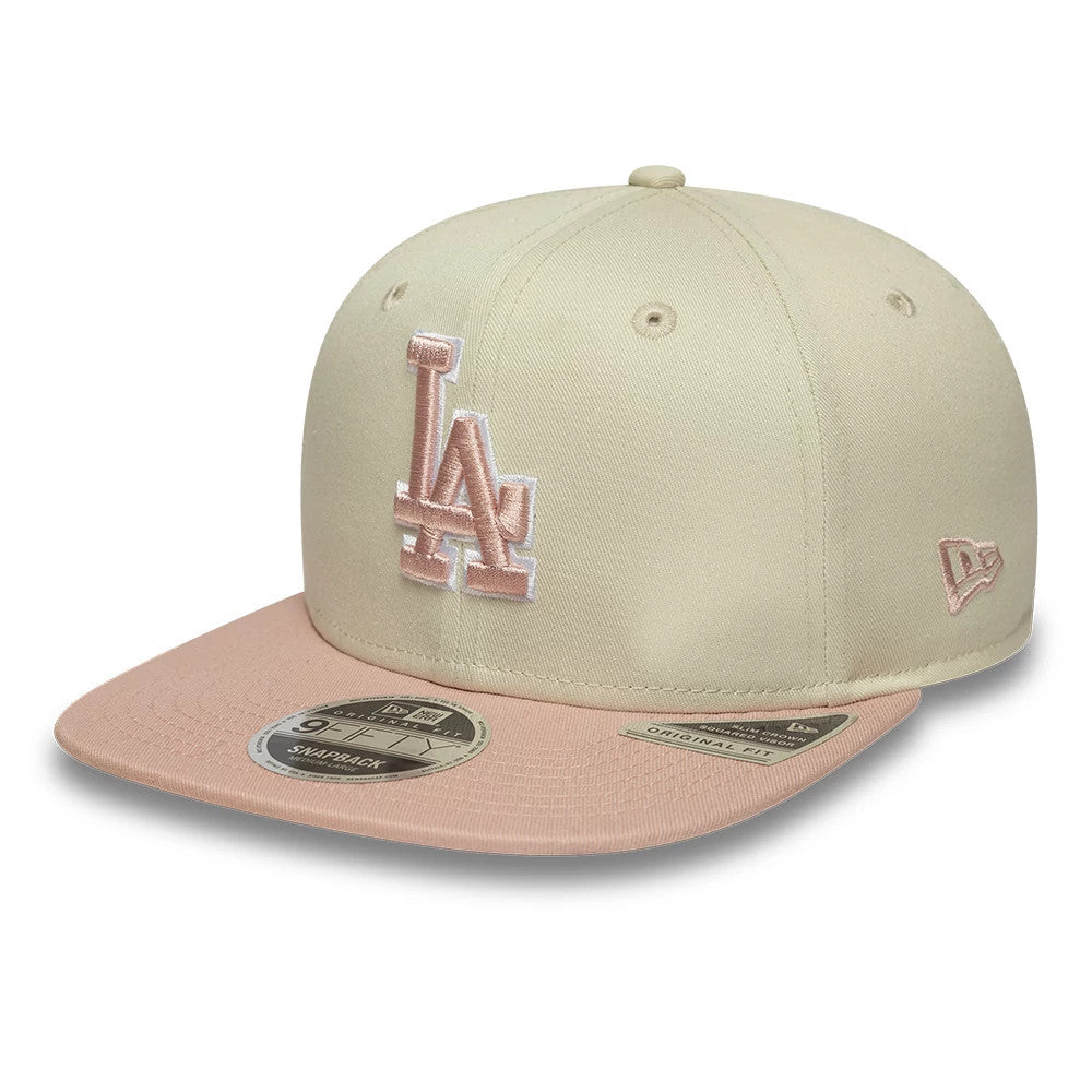 LA Dodgers MLB World Series Patch Light Beige New Era 9FIFTY Snapback Adjustable Cap, front view showing the raised pink LA logo embroidered on the structured beige crown, with a pink visor and a 9FIFTY size sticker on top.