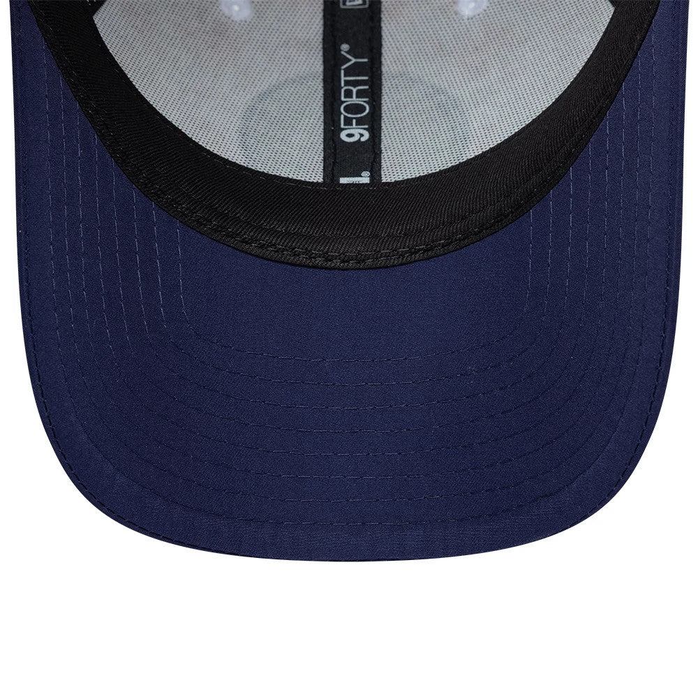 Paris Saint-Germain Cherry Blossom Navy New Era 9FORTY Adjustable Cap, inside view showing a black sweatband with the 9FORTY label, a grey undervisor and contrasting internal seam taping running across the structured navy crown.
