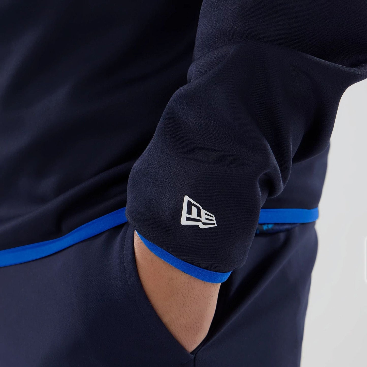 The model is wearing this Atlassian Williams F1 Team Mid Layer 1/4 Zip Long Sleeve T-Shirt in navy. 7