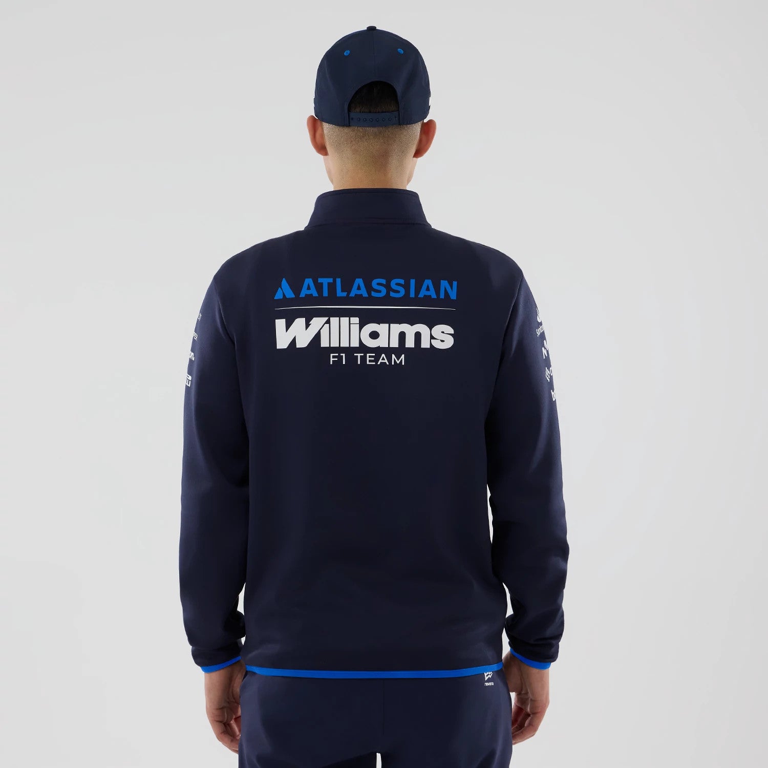 The model is wearing this Atlassian Williams F1 Team Mid Layer 1/4 Zip Sweatshirt in navy. 2