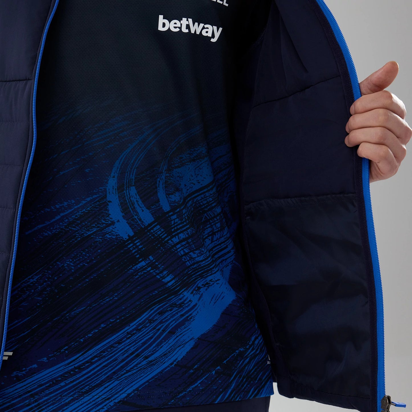 The model is wearing this Atlassian Williams F1 Team Hybrid Jacket in navy. 7