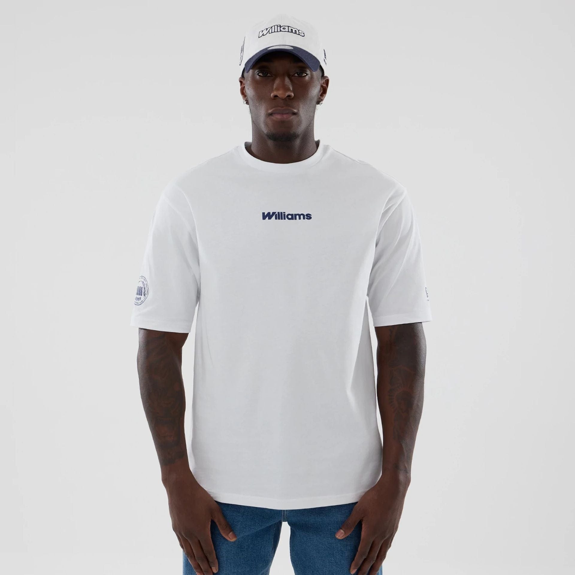 The model is wearing this Atlassian Williams F1 Team Japan 1996 World Champions Oversized T-Shirt in white. 1