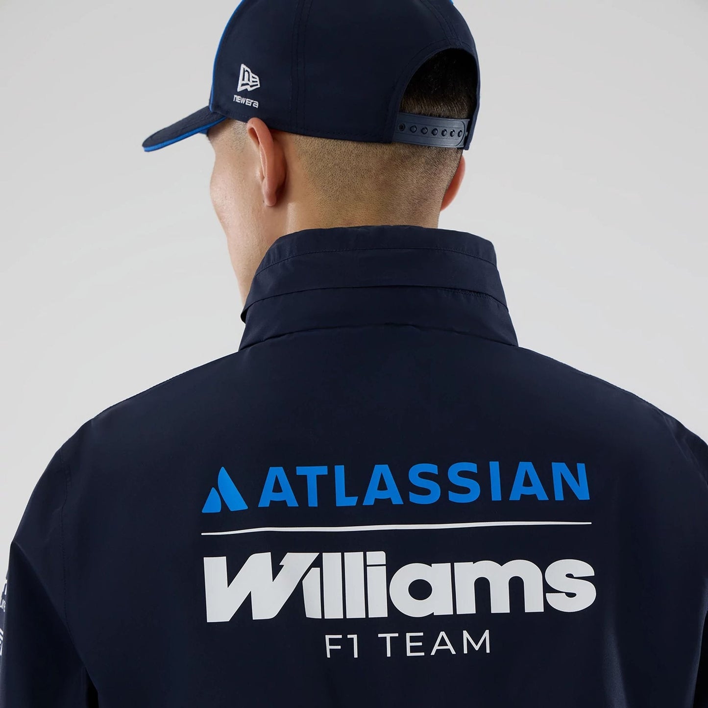 The model is wearing this Atlassian Williams F1 Team Rain Jacket in navy. 7