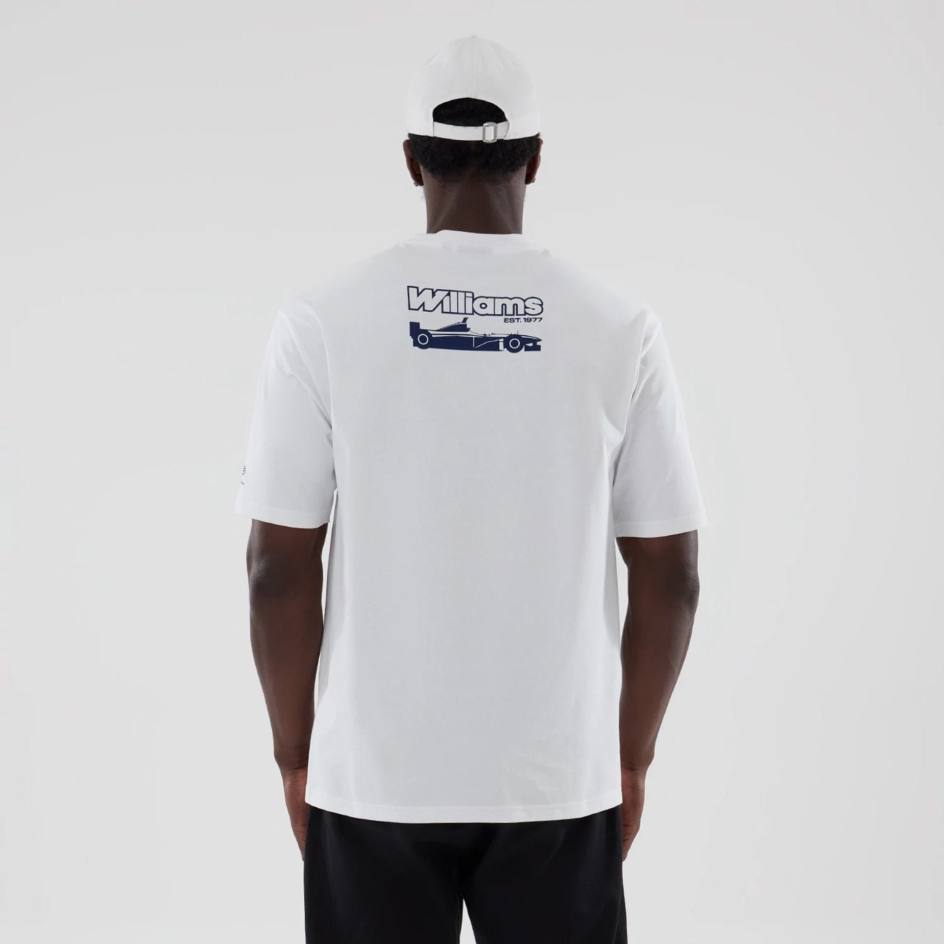 The model is wearing this Atlassian Williams F1 Team Japan 1996 World Champions Oversized T-Shirt in white. 2