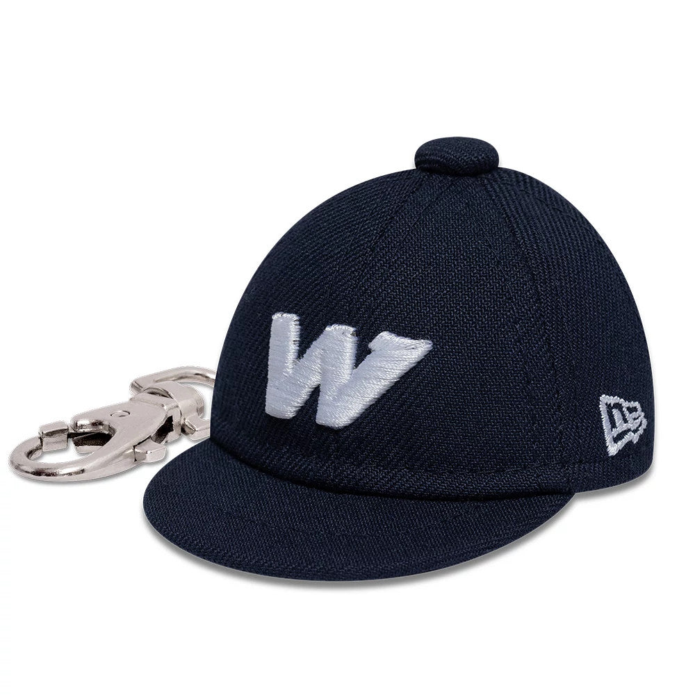 New Era Williams Navy Cap Key Chain, three-quarter view showing the white embroidered W logo on the front panel, a curved navy visor, and the New Era flag logo on the left side, with a key chain attachment.