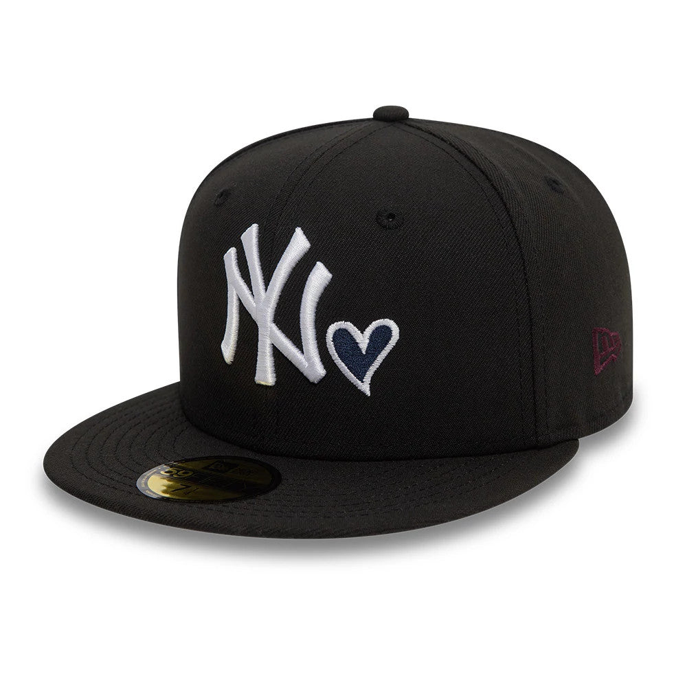 New York Yankees MLB Heart Icon Black New Era 59FIFTY Fitted Cap, front view showing raised white NY logo alongside a navy heart on the front panel, with a gold 59FIFTY size sticker on the black flat visor and New Era flag logo on the left side.