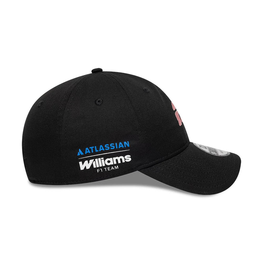 Williams Alex Albon Black New Era 9TWENTY Adjustable Cap, side view showing the blue Atlassian logo with white Williams F1 Team lettering on the black crown, curved black visor, and a 9TWENTY size sticker on the top of the visor.