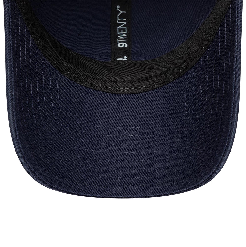 Williams Traditional Washed Navy New Era 9TWENTY Adjustable Cap, inside view showing the dark navy undervisor, black sweatband, and black taping with white 9TWENTY branding along the inner seam.