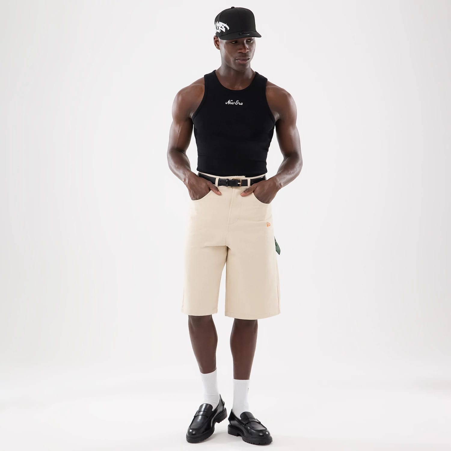 The model is wearing this New Era Rib Vest in black. 3