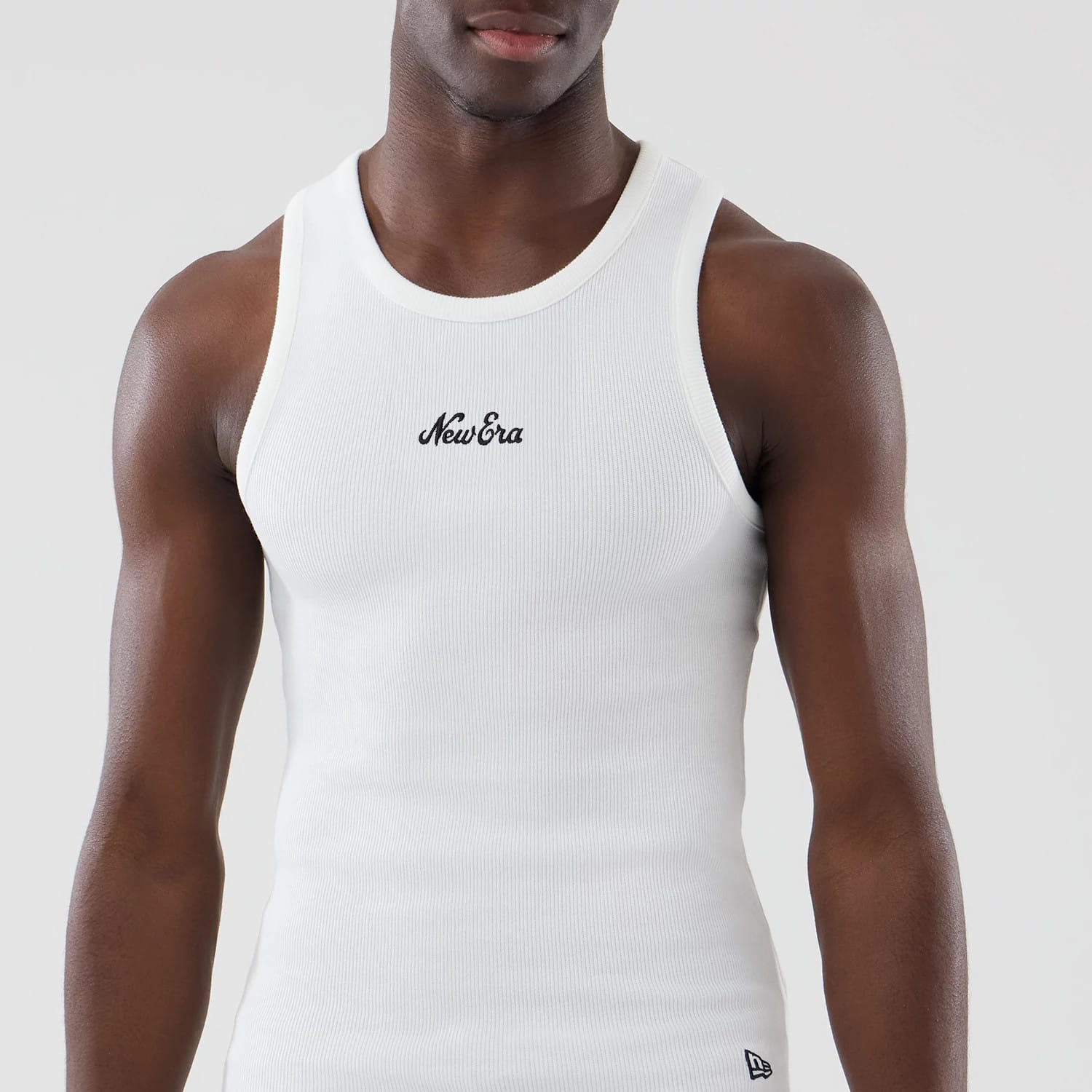 The model is wearing this New Era Rib Vest in white. 3