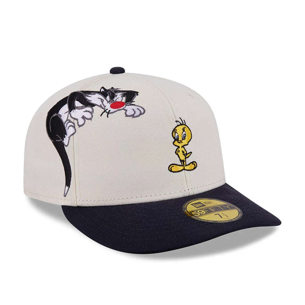 Pictured is this Looney Tunes Pwetty Cat Multi Character 59FIFTY Fitted cap in beige & navy. 1