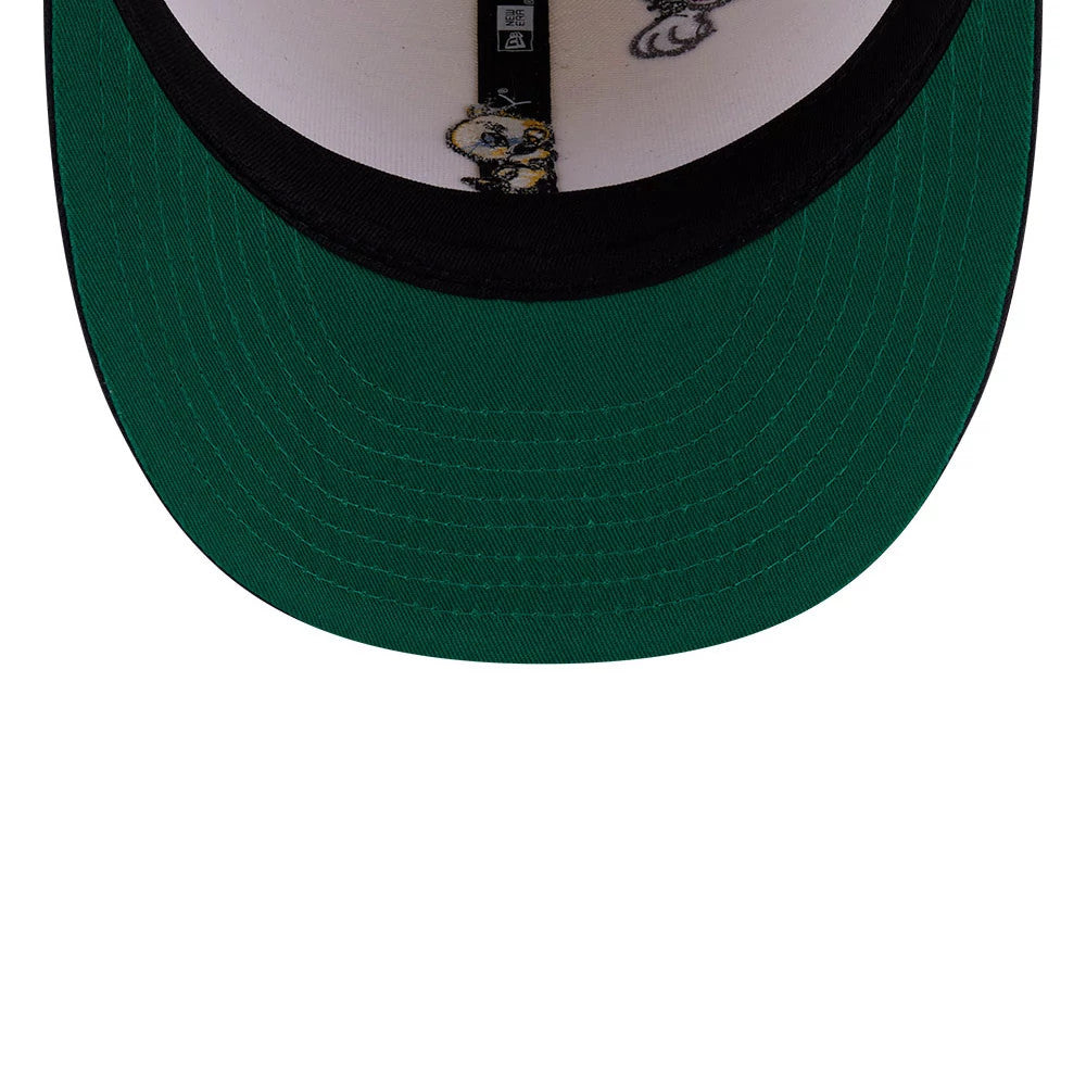 Multi Character Looney Tunes Pwetty Cat Beige & Navy New Era 59FIFTY Fitted Cap, inside view showing the bright green undervisor, black headband lining, and character graphics on the white fabric beneath the crown's taping.