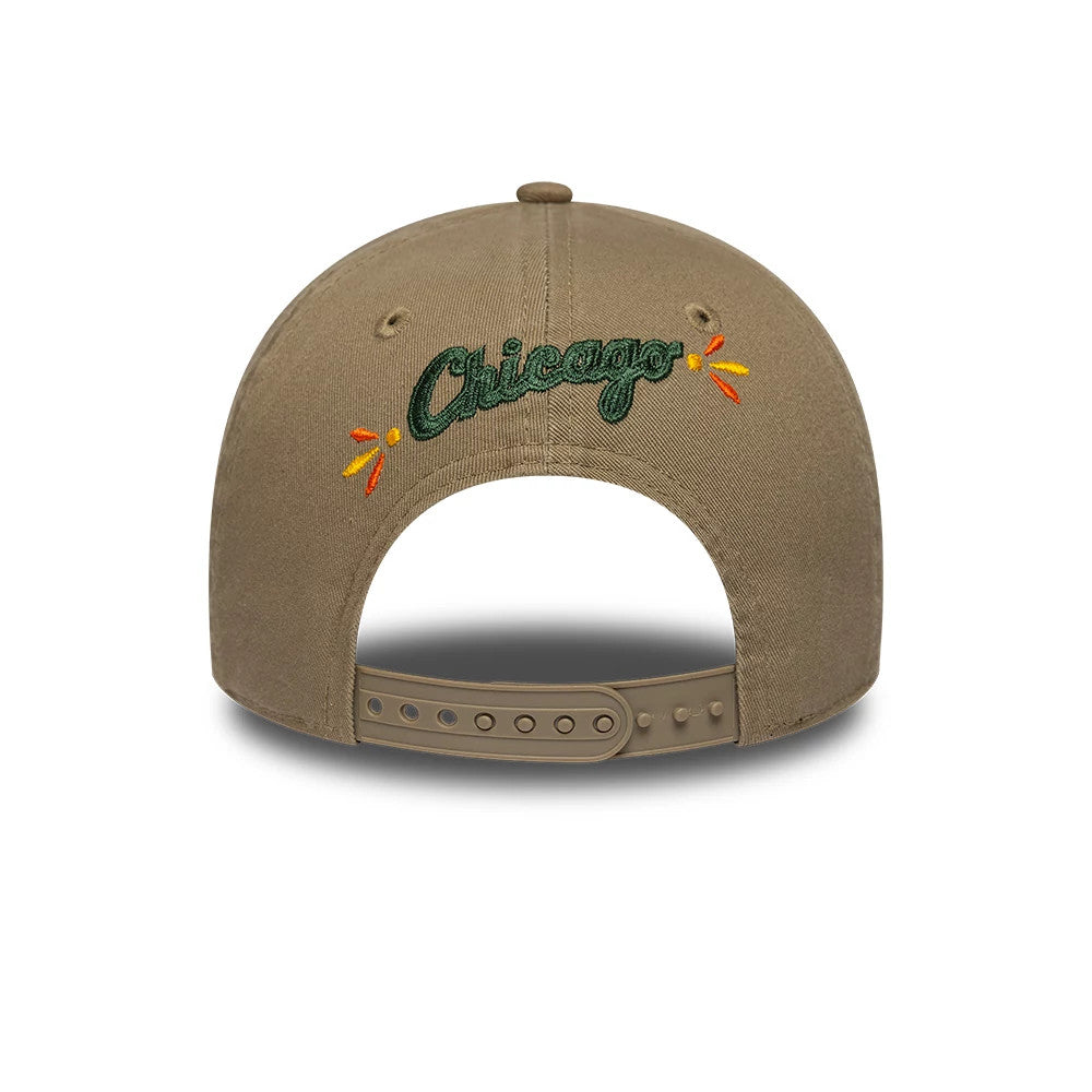 Chicago White Sox MLB Vibrant Festivities Beige New Era 9FORTY A-Frame Adjustable Cap, rear view showing the dark green embroidered Chicago text on the beige crown, highlighted with orange and yellow accents, and a beige adjustable strap.