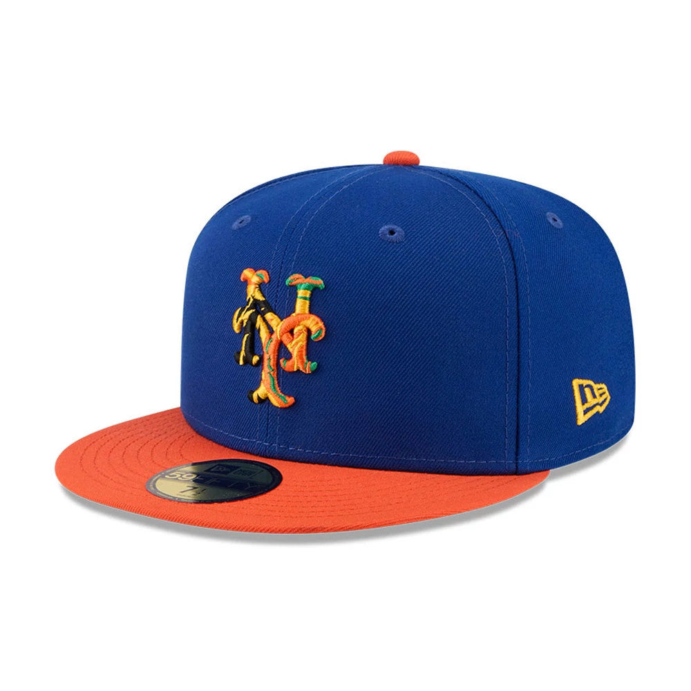 New York Mets MLB X Coming To America Blue New Era 59FIFTY Fitted Cap, three-quarter view showing a colourful Mets logo embroidered on the front panels, a contrasting orange visor, and a yellow New Era flag logo on the left side.
