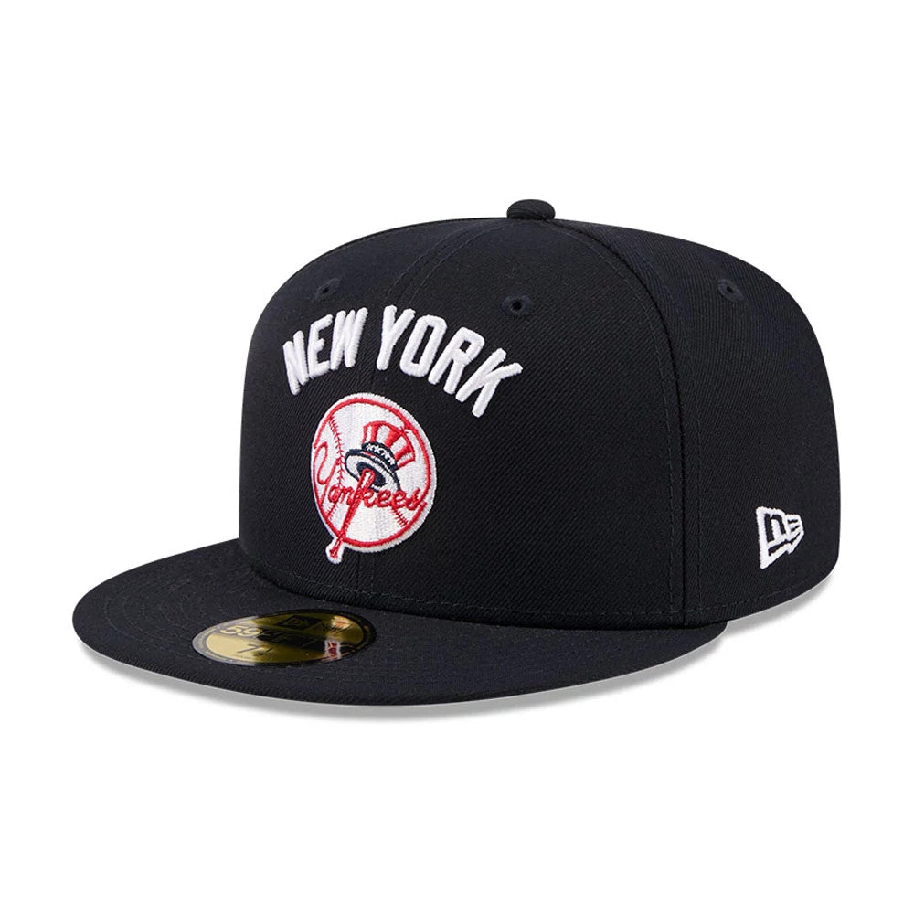 New York Yankees MLB X Seinfeld Navy New Era 59FIFTY Fitted Cap, three-quarter view showing the white embroidered New York lettering and red Yankees logo on the front panel, with a New Era flag logo on the left side.