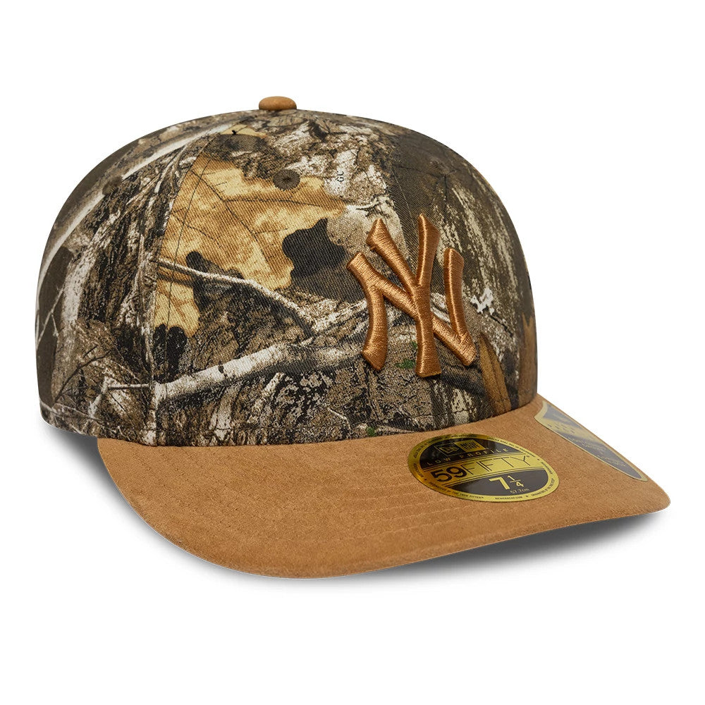 New York Yankees MLB Realtree Assorted Print Low Profile New Era 59FIFTY Fitted Cap, three-quarter view showing raised brown embroidered NY logo on the front panel, brown flat visor with a gold 59FIFTY size sticker on top, and camo pattern crown.