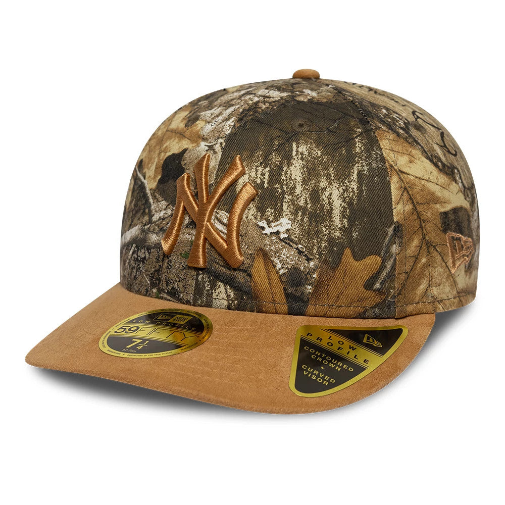 New York Yankees MLB Realtree Assorted Print Low Profile New Era 59FIFTY Fitted Cap, three-quarter view showing the raised brown embroidered NY logo on the front panels, camo pattern, brown visor, New Era flag logo on the left side.