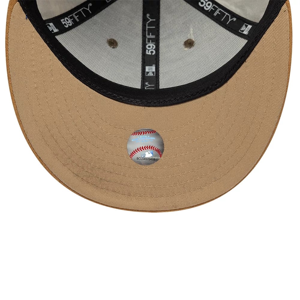 New York Yankees MLB Realtree Assorted Print Low Profile New Era 59FIFTY Fitted Cap, inside view showing black 59FIFTY taping across the grey panels, a tan undervisor with a round holographic sticker displaying a red baseball seam design.