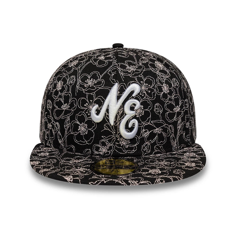 New Era Cherry Blossom Black 59FIFTY Fitted Cap, front view showing a white raised embroidered NE logo on a black structured crown, featuring an intricate cherry blossom pattern and a gold 59FIFTY size sticker on the flat black visor.