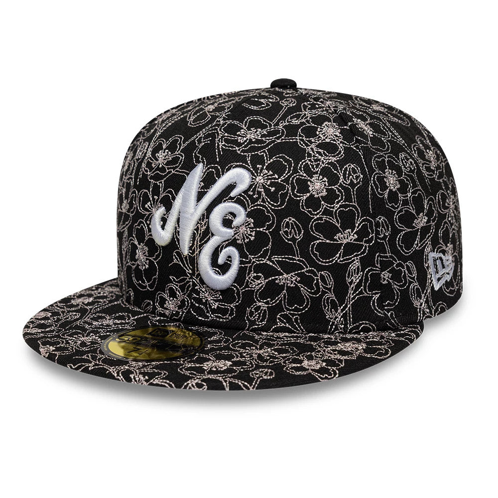 New Era Cherry Blossom Black 59FIFTY Fitted Cap, front view showing the white raised NE embroidery on a cherry blossom patterned black crown, black visor with matching pattern, and gold 59FIFTY size sticker on the visor.