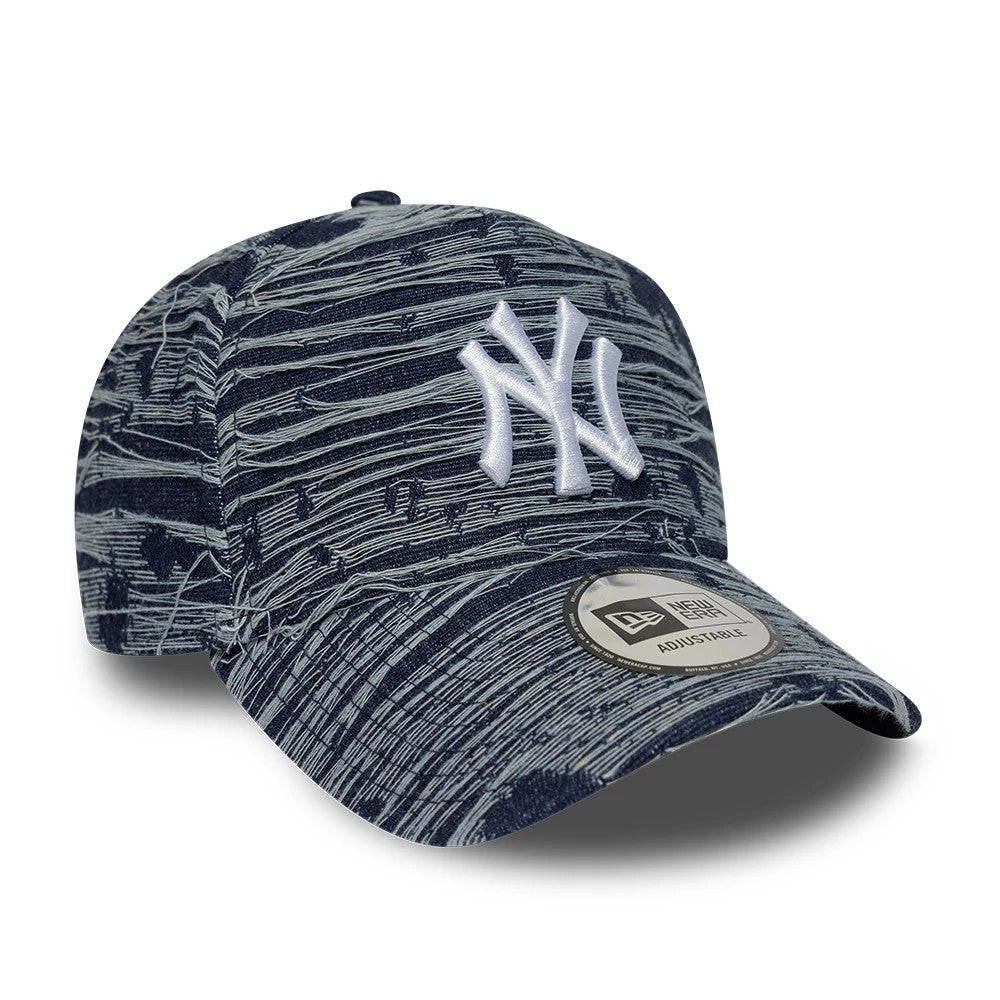 New York Yankees MLB Distressed Denim Navy New Era 9FORTY E-Frame Adjustable Cap, three-quarter view showing a white raised embroidered NY logo on the front panel, with a navy denim distressed pattern and a 9FORTY size sticker on the curved visor.