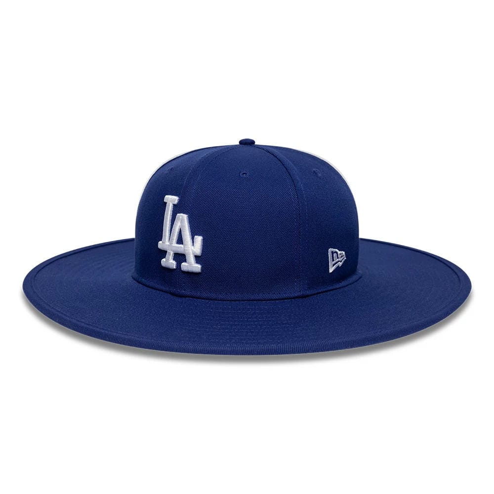 New Era LA Dodgers MLB 6 Panel Dark Blue Fitted Bucket Hat, side view showing the white embroidered LA logo on the structured crown, the wide visor extending uniformly around the hat, and the New Era flag logo embroidered on the left side.