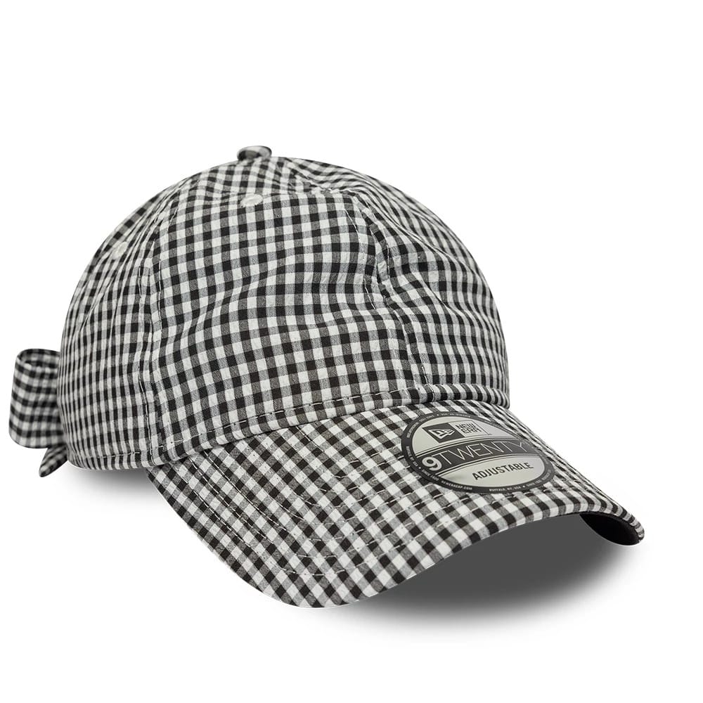 New Era Gingham Bowback Black 9TWENTY Adjustable Cap, three-quarter view showing a black and white gingham pattern across the entire cap, with a bow at the back and a 9TWENTY size sticker on the curved visor.