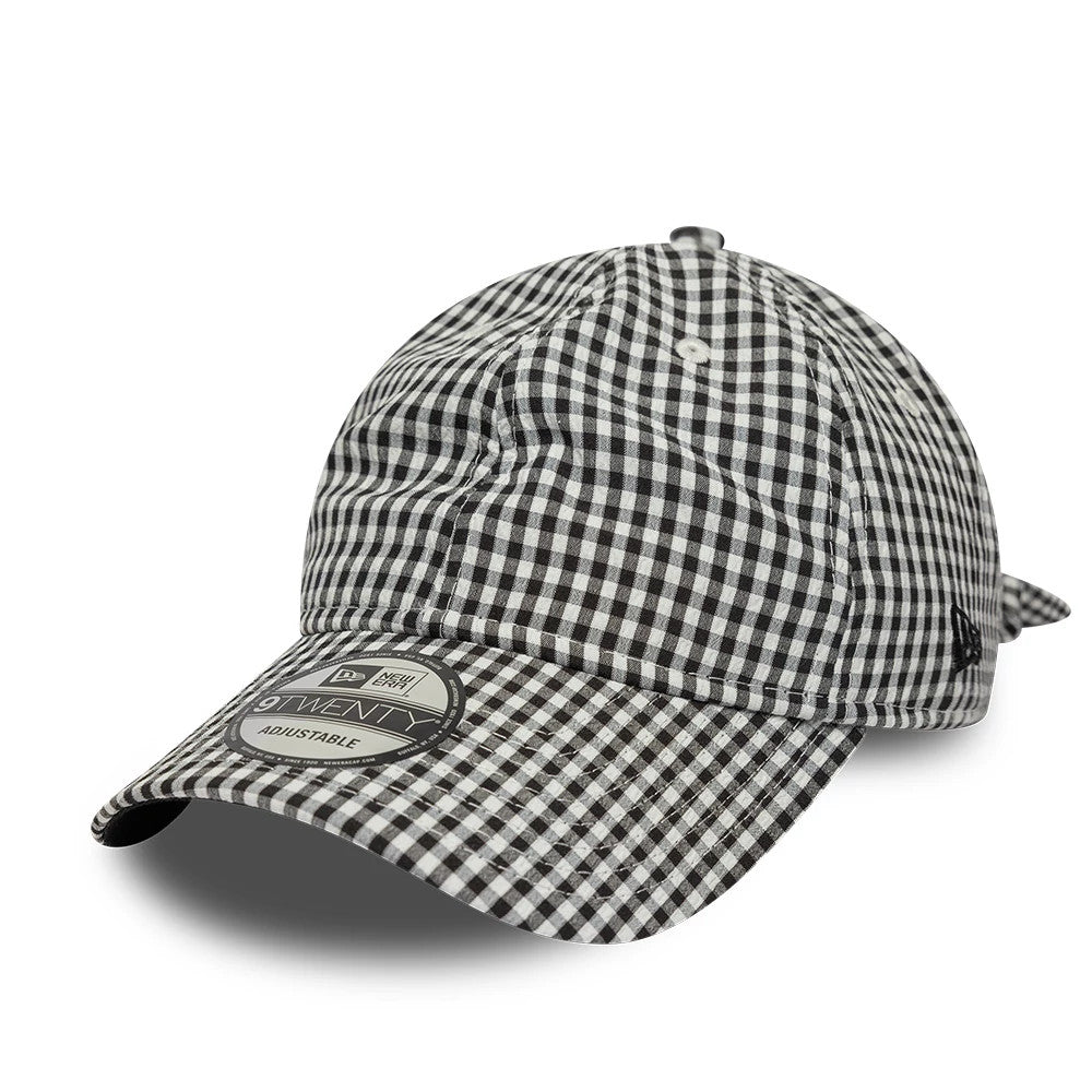 New Era Gingham Bowback Black 9TWENTY Adjustable Cap, three-quarter view showing the black and white gingham pattern across the unstructured crown and curved visor, with a prominent 9TWENTY size sticker on the visor.