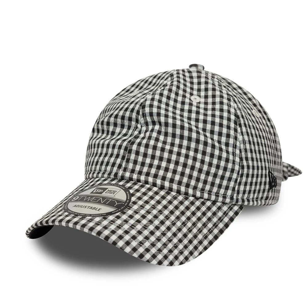 New Era Gingham Bowback Black 9TWENTY Adjustable Cap, three-quarter view showing the black and white gingham pattern across the unstructured crown and curved visor, with a prominent 9TWENTY size sticker on the visor.