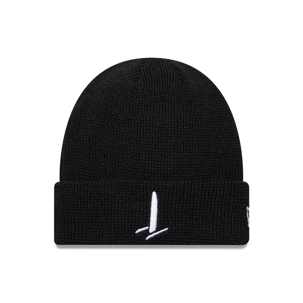 New Era Sail GP Waffle Black Cuff Knit Beanie, front view showing a prominent white embroidered logo on the folded cuff, with a waffle-knit textured pattern and a New Era flag logo on the left side.