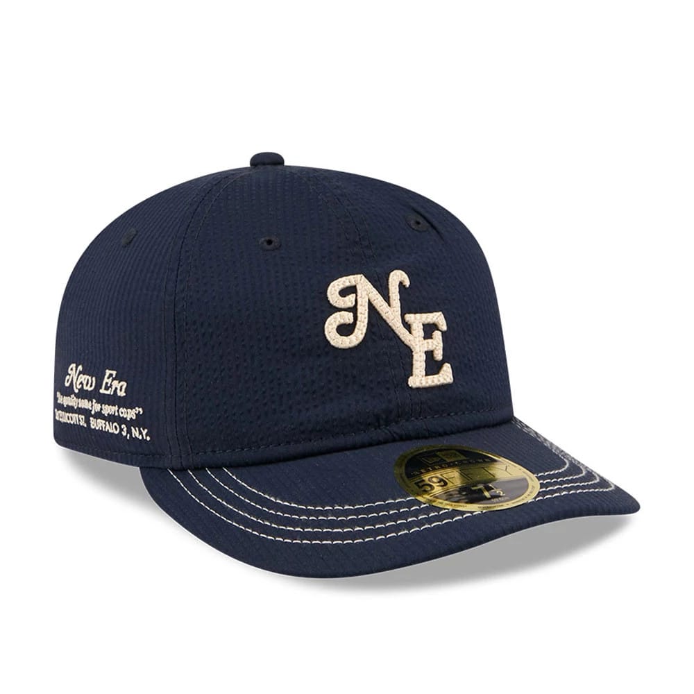 Pictured is this New Era 59FIFTY Day Seersucker Retro Crown 59FIFTY Fitted cap in navy. 1