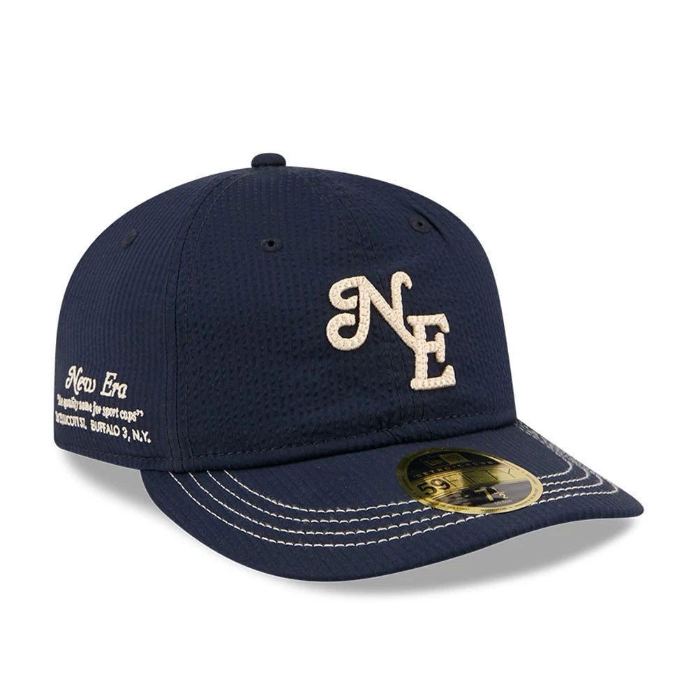 Pictured is this New Era 59FIFTY Day Seersucker Retro Crown 59FIFTY Fitted cap in navy. 1
