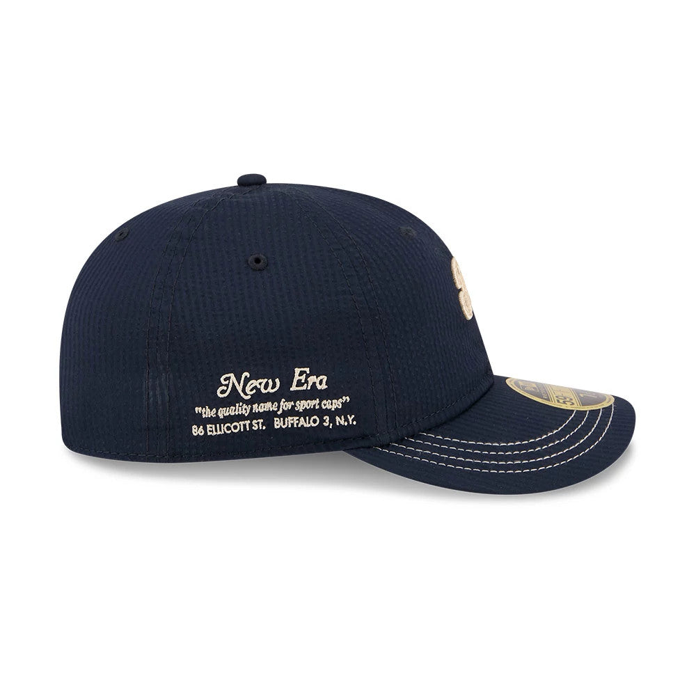 Pictured is this New Era 59FIFTY Day Seersucker Retro Crown 59FIFTY Fitted cap in navy. 4